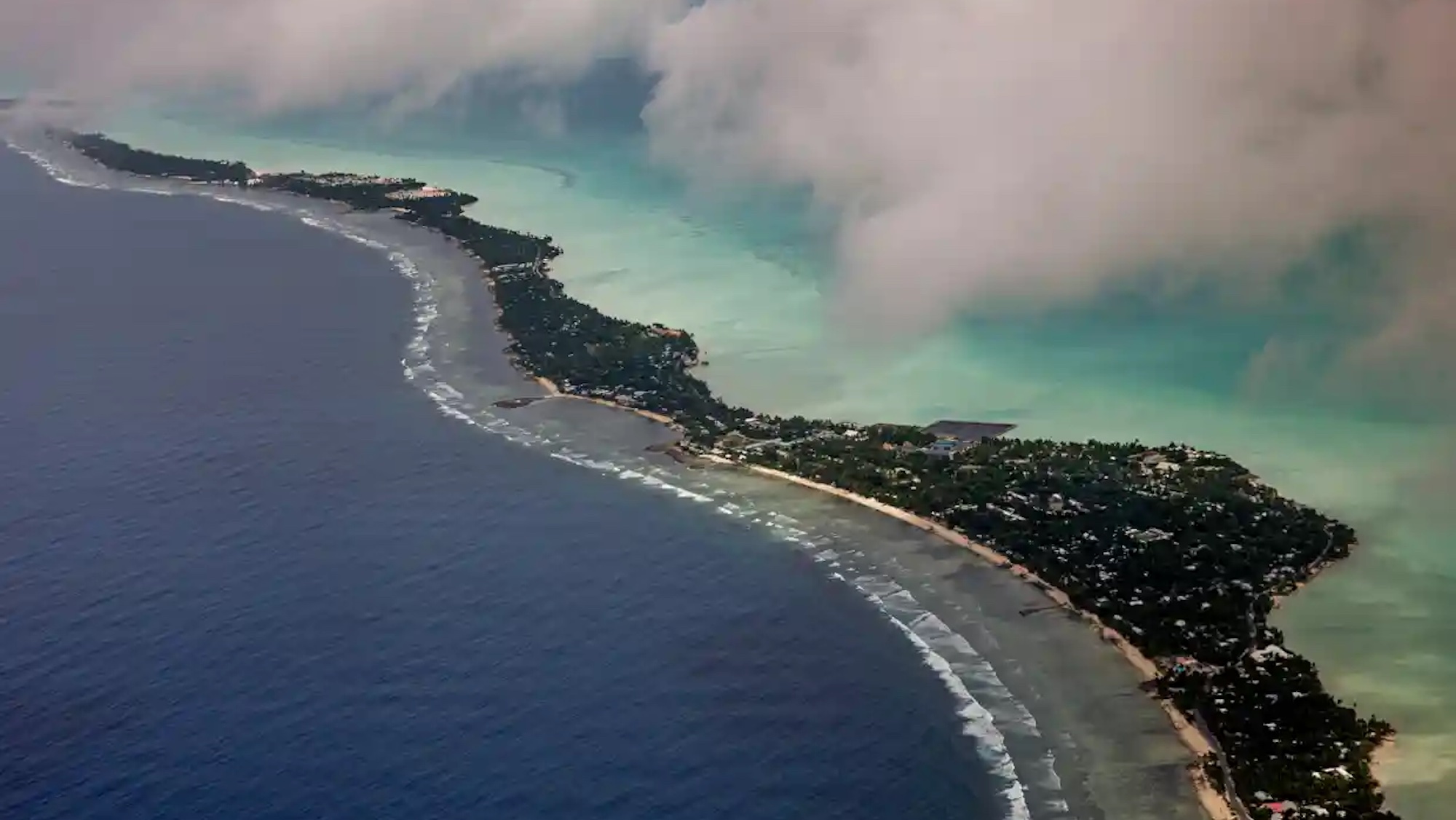 The coastline of the island Kiribati, with clouds obstructing some of the view