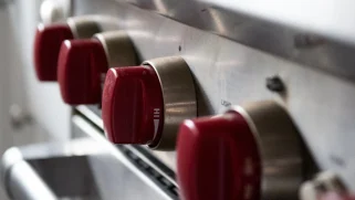 Red knobs on a steel gas stove