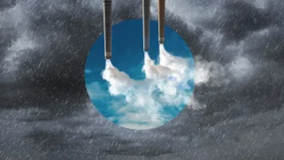 Upside-down smoke stacks reveal a clean sky in the middle of a rain storm.