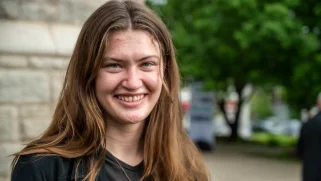 Image of white girl with long brown hair, smiling.