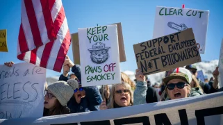 A group of protesters protesting against Trump's attack on national parks