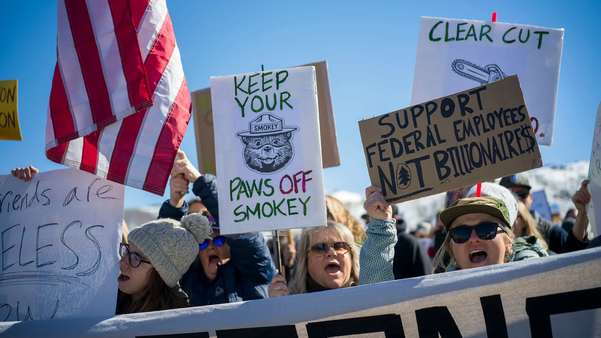 A group of protesters protesting against Trump's attack on national parks