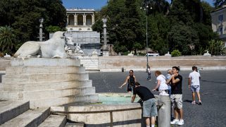 People cool off during an ongoing heat wave with temperatures reaching 40 degrees at Piazza del Popolo in Rome, Italy, on July 6, 2025. (Photo by Massimo Valicchia/NurPhoto via AP)