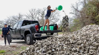 Volunteers drying oyster shells to ensure the eradication of any invasive or non-native species before they are used in vertical oyster gardens.